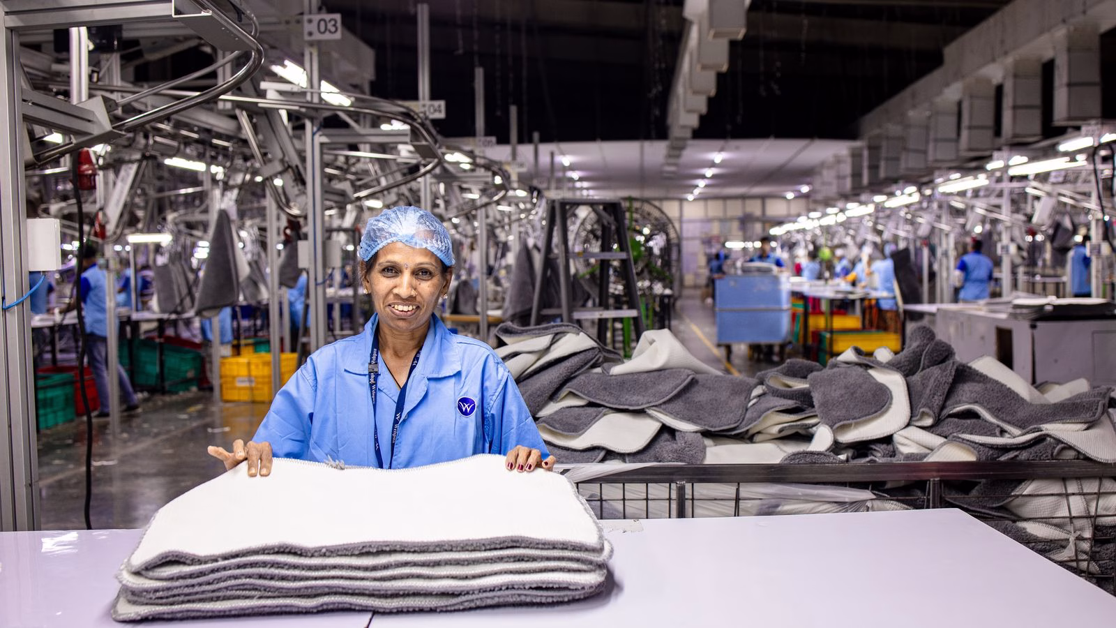 manufacturing worker on a production floor handling materials